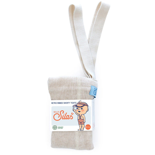 A pack of Silas brand shorty cotton tights with braces in a cream color, displayed with the packaging that features a cartoon illustration.