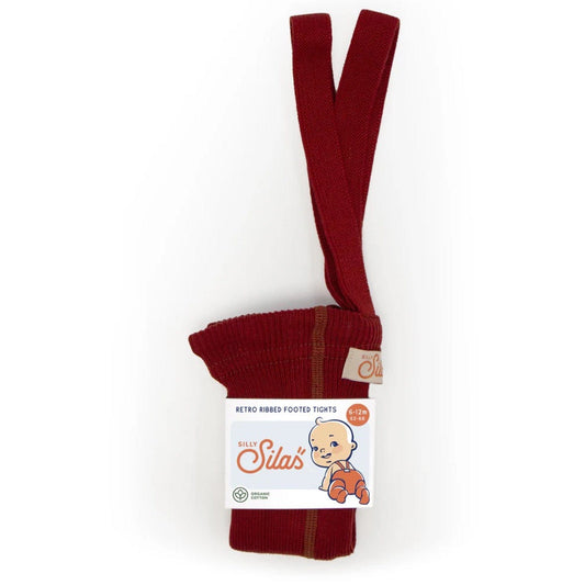 Red baby tights with a label on a white background