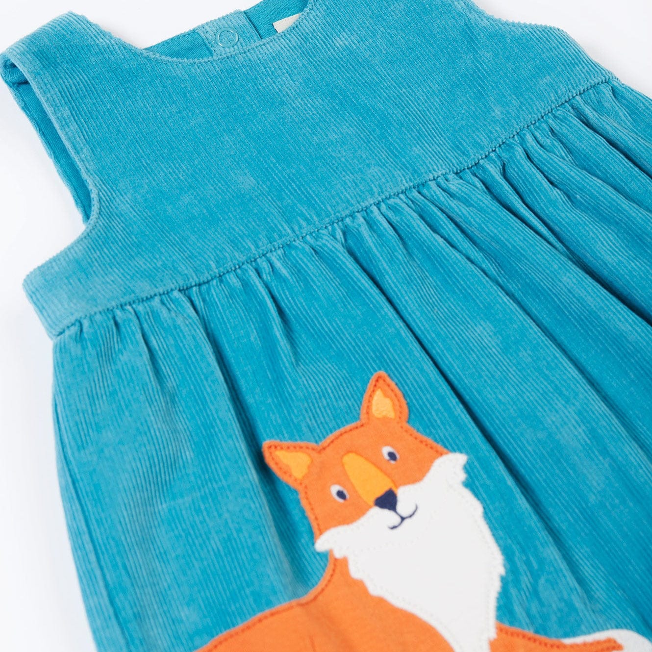 Blue dress with a fox design on a white background