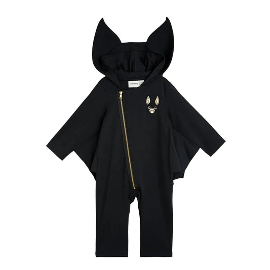 A black hooded one-piece jumpsuit with bat-wing sleeves, a front zipper, and a small gold fox face graphic on the left chest, displayed on a light gray background.