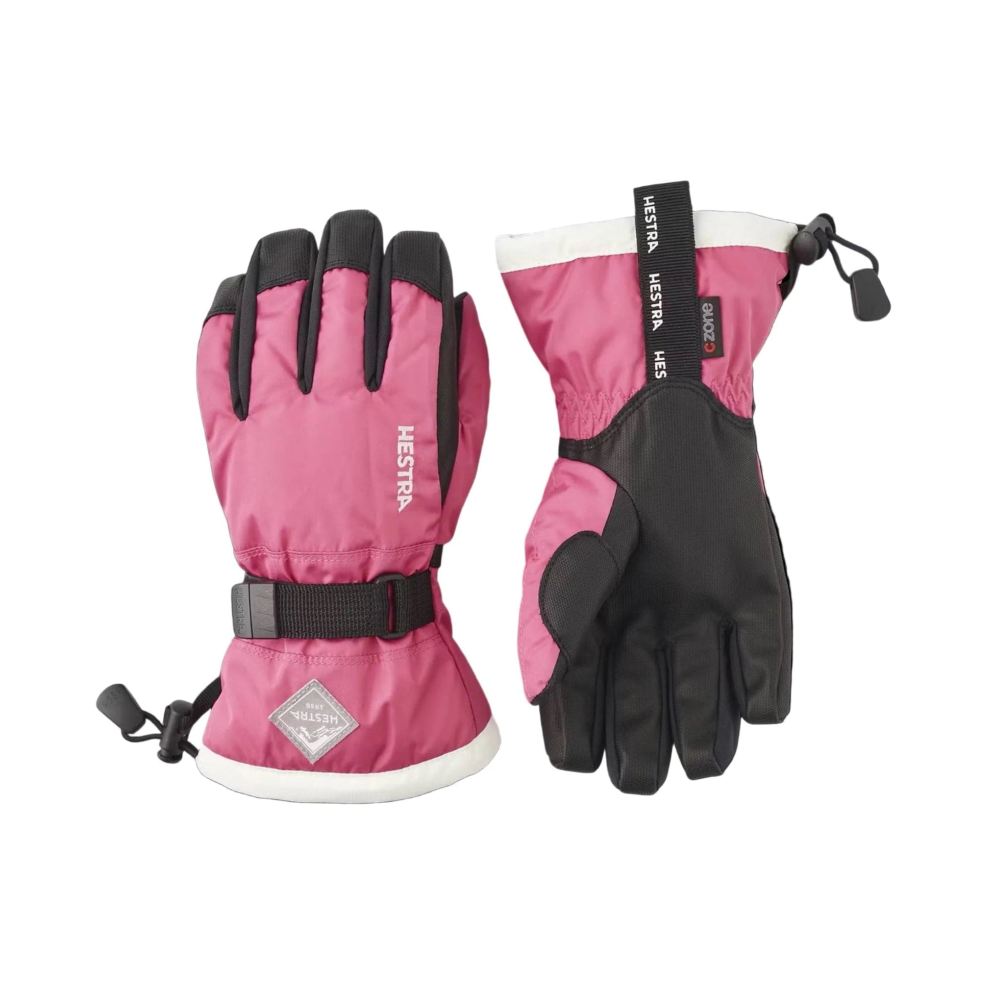 Pink and black gloves with visible Hestra branding on a white background