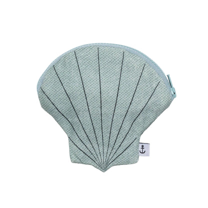 Shell-shaped pouch with textured surface on a light gray background