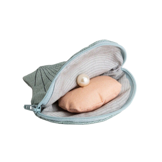Small pouch with a pink item and pearl on a white background