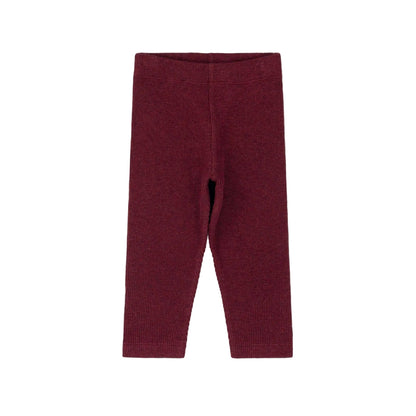 A pair of ribbed knit leggings in a deep burgundy red