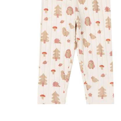 A pair of children's leggings with a vertical stripe pattern and a whimsical woodland print featuring pine trees, mushrooms, and cute pink-haired animals on an off-white background.