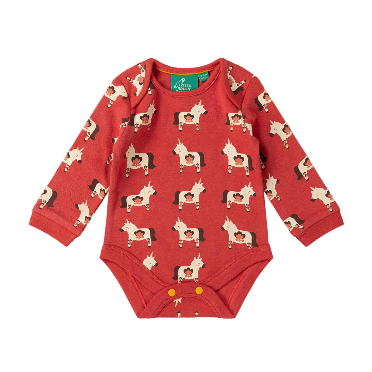 A baby long-sleeve bodysuit in red with an all-over print of cartoon horses, featuring snap closures at the crotch, laid flat on a light beige background.