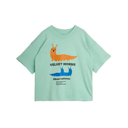 A mint green short-sleeve t-shirt featuring a graphic of two cartoon velvet worms, one orange and one blue, with black text reading 'VELVET WORMS' and 'Observations:'.