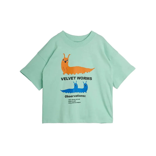 A mint green short-sleeve t-shirt featuring a graphic of two cartoon velvet worms, one orange and one blue, with black text reading 'VELVET WORMS' and 'Observations:'.