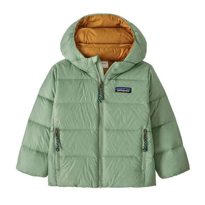 Green puffer jacket with a visible brand logo on a white background