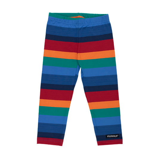 A pair of children's leggings with horizontal rainbow stripes in blue, red, orange, green, and navy, featuring a small black brand tag on the lower left leg.