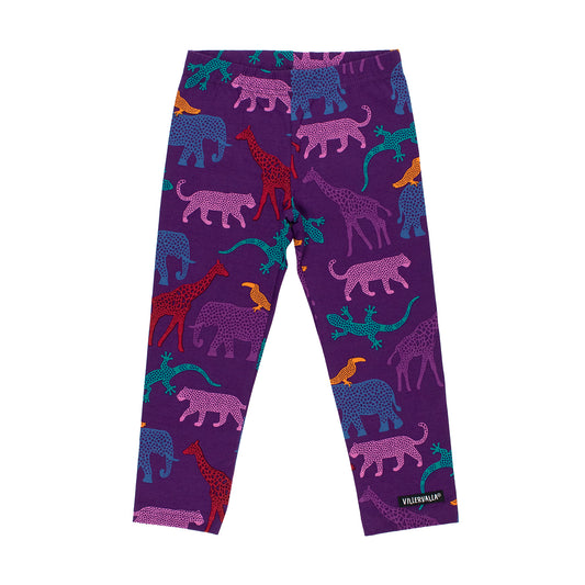 Purple children's leggings with an all-over safari animal print featuring pink, red, blue, and teal spotted giraffes, elephants, lions, and lizards. A small black brand tag reading 'TRINKERLIP' is visible near the lower right hem.