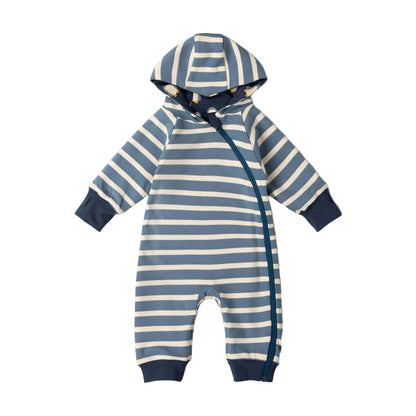 A baby hooded one-piece romper with horizontal blue and cream stripes, navy blue cuffs and hem, and a navy side zipper, shown on a light pink background.