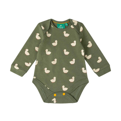 An olive green long-sleeve baby bodysuit with a repeating duck print, featuring three yellow snap buttons at the crotch, laid flat on a light pink background.