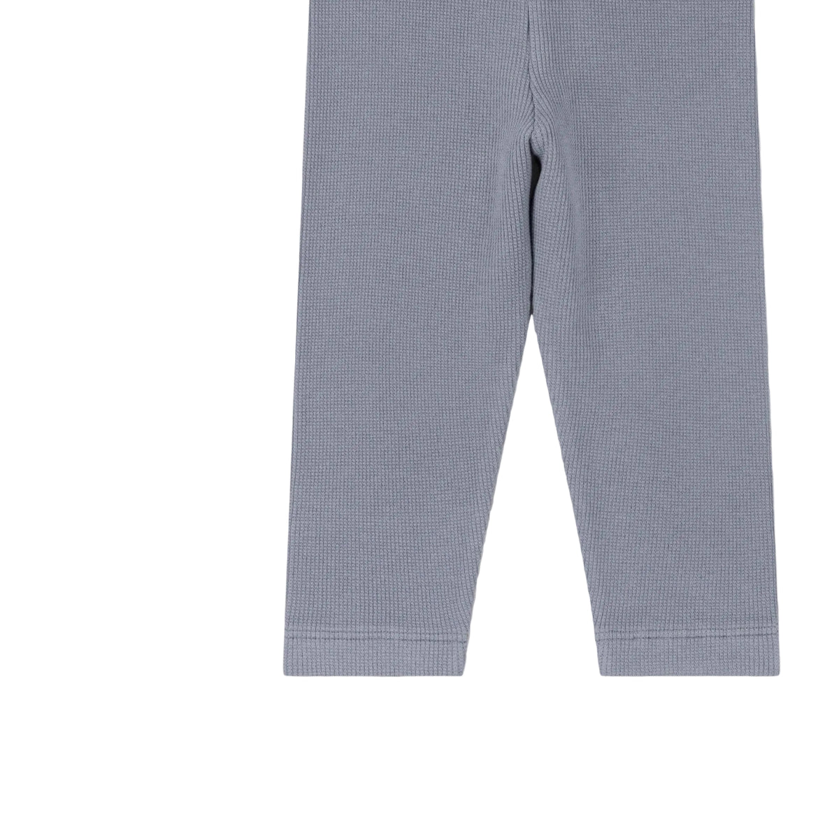 Light blue ribbed knit leggings shown flat against a pale pink background.